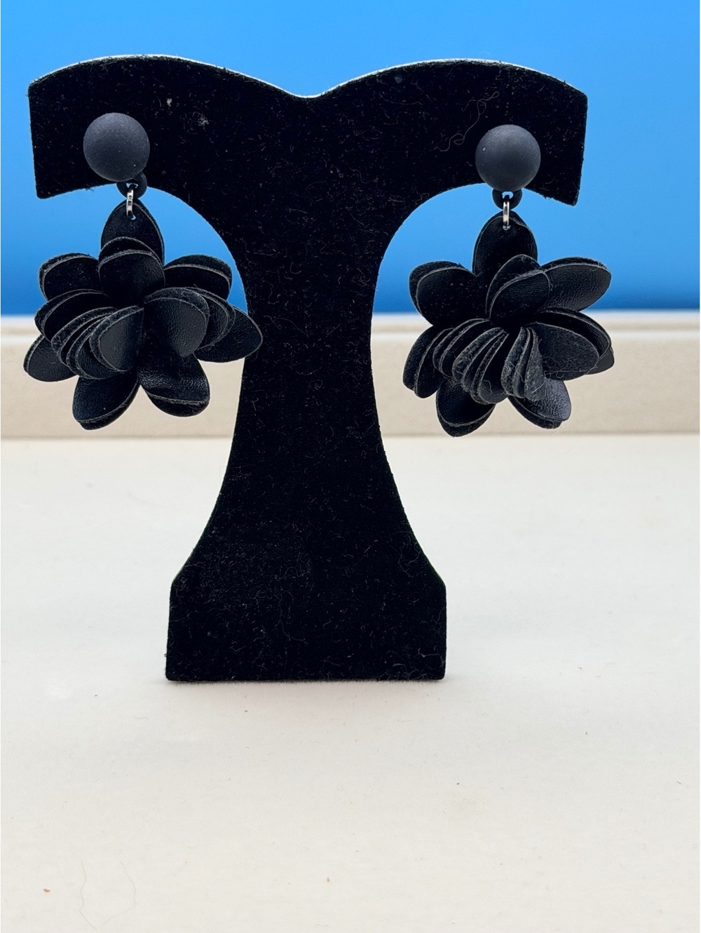 Black flower dangle earrings